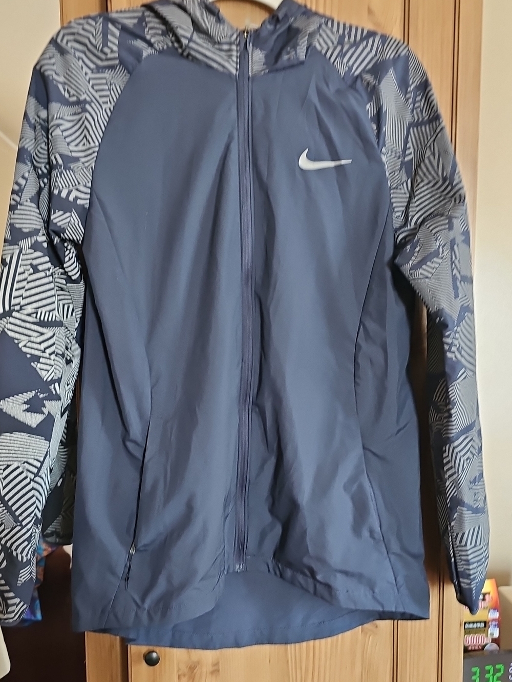 Nike Women's Navy Hooded Windbreaker with Patterned Sleeves